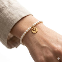 Symbolic Blessing Charm & Pearl Strand